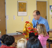 Image of man teaching children